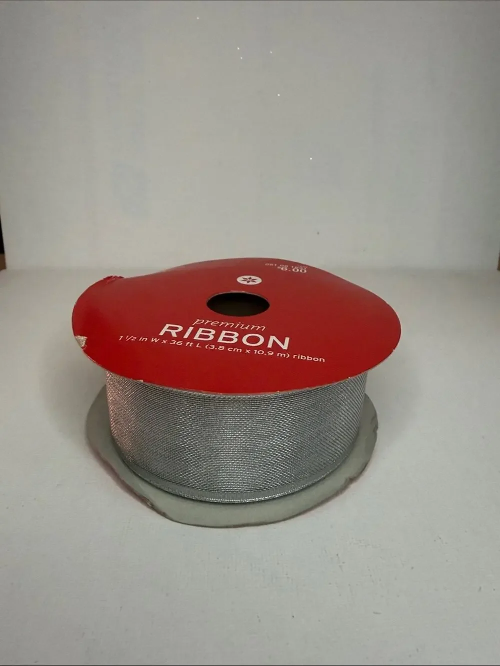 Silver Metallic Ribbon on Red Spool
